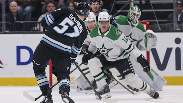 Jan 15, 2026; Salt Lake City, Utah, USA; Utah Mammoth defenseman Nick DeSimone (57) takes a shot against the Dallas Stars during the third period at Delta Center. Mandatory Credit: Rob Gray-Imagn Images