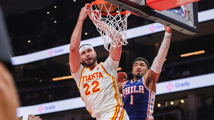 Oct 14, 2024; Atlanta, Georgia, USA; Atlanta Hawks forward Larry Nance Jr. (22) is fouled by Philadelphia 76ers forward KJ Martin (1) in the fourth quarter at State Farm Arena. Mandatory Credit: Brett Davis-Imagn Images