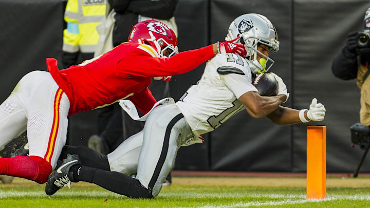 Nov 29, 2024; Kansas City, Missouri, USA; Las Vegas Raiders wide receiver Tre Tucker (11) scores a touchdown against Las Vegas Raiders place kicker Daniel Carlson (2) during the second half at GEHA Field at Arrowhead Stadium. Mandatory Credit: Jay Biggerstaff-Imagn Images Nov 29, 2024; Kansas City, Missouri, USA; Las Vegas Raiders wide receiver Tre Tucker (11) scores a touchdown against Las Vegas Raiders place kicker Daniel Carlson (2) during the second half at GEHA Field at Arrowhead Stadium. Mandatory Credit: Jay Biggerstaff-Imagn Images