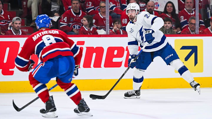 Apr 26, 2026; Montreal, Quebec, CAN; Tampa Bay Lightning defenseman Max Crozier (24) plays the puck against Montreal Canadiens defenseman Mike Matheson (8) during the second period in game four of the first round of the 2026 Stanley Cup Playoffs at Bell Centre. Mandatory Credit: David Kirouac-Imagn Images