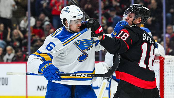 Dec 6, 2025; Ottawa, Ontario, CAN; Ottawa Senators center Tim Stutzle (18) fights St. Louis Blues defenseman Philip Broberg (6) during the third period at Canadian Tire Centre. Mandatory Credit: David Kirouac-Imagn Images