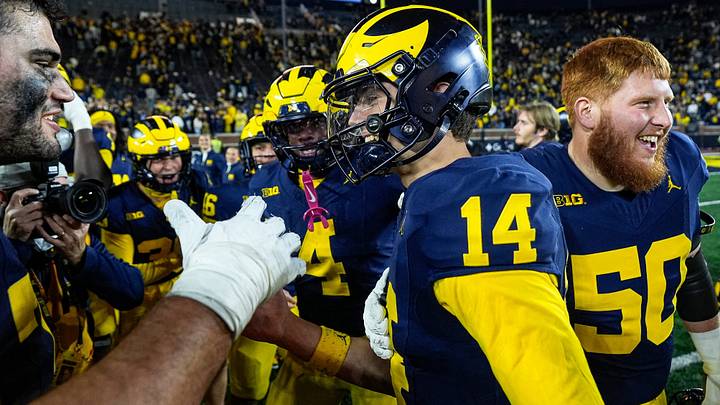Michigan quarterback Tommy Carr is congratulated by teammates after 21-18 win over Penn State Michigan quarterback Tommy Carr is congratulated by teammates after 21-18 win over Penn State