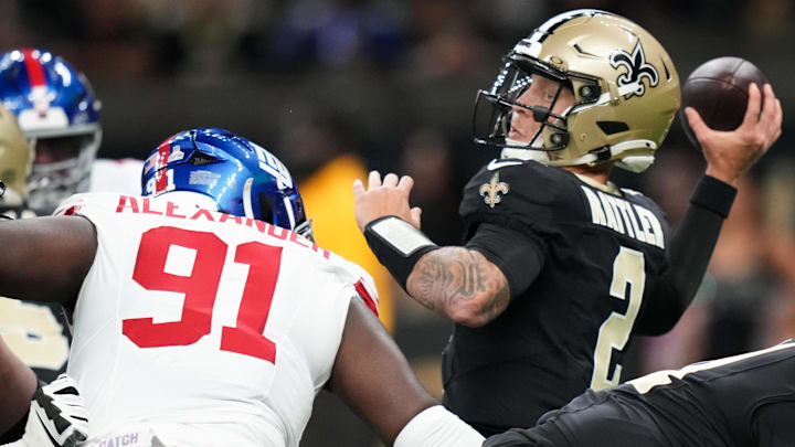 Oct 5, 2025; New Orleans, Louisiana, USA; New Orleans Saints quarterback Spencer Rattler (2) passes the ball as New York Giants defensive tackle Darius Alexander (91) applies pressure during the first quarter at Caesars Superdome. Mandatory Credit: Matthew Hinton-Imagn Images