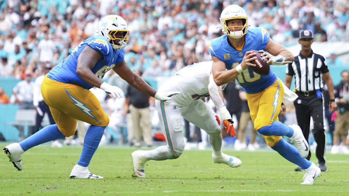 Los Angeles Chargers quarterback Justin Herbert (10) runs the ball against the Miami Dolphins during the third quarter at Hard Rock Stadium. Los Angeles Chargers quarterback Justin Herbert (10) runs the ball against the Miami Dolphins during the third quarter at Hard Rock Stadium.