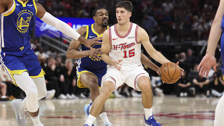 Mar 5, 2026; Houston, Texas, USA; Golden State Warriors guard De'anthony Melton (8) attempts to steal the ball from Houston Rockets guard Reed Sheppard (15) during the fourth quarter at Toyota Center. Mandatory Credit: Troy Taormina-Imagn Images