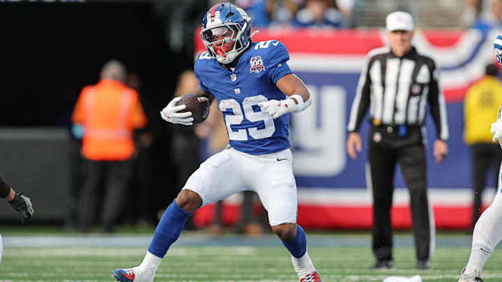 Dec 29, 2024; East Rutherford, New Jersey, USA; New York Giants running back Tyrone Tracy Jr. (29) carries the ball during the first half against the Indianapolis Colts at MetLife Stadium.  