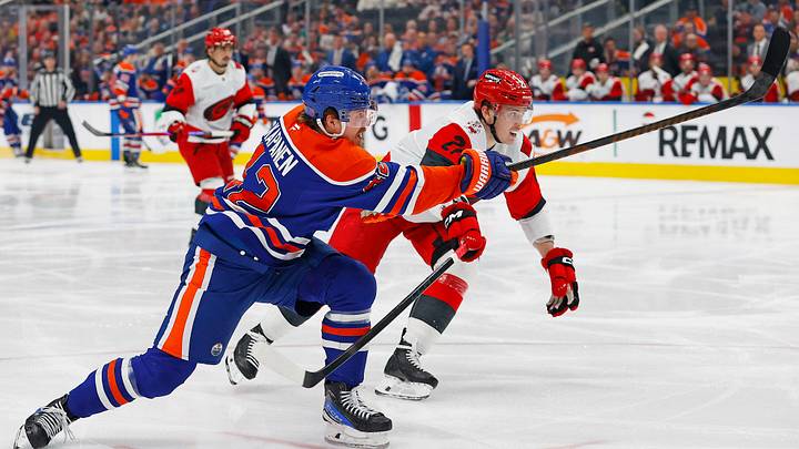 Mar 6, 2026; Edmonton, Alberta, CAN; Edmonton Oilers forward Kasperi Kapanen (42) takes a shot in front of Carolina Hurricanes forward Nikolaj Ehlers (27) during the third period at Rogers Place. Mandatory Credit: Perry Nelson-Imagn Images