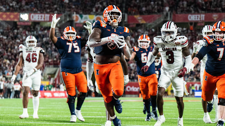 Dec 31, 2024; Orlando, FL, USA; Illinois Fighting Illini running back Josh McCray (6) runs for the touchdown against the South Carolina Gamecocks in the fourth quarter at Camping World Stadium. Mandatory Credit: Jeremy Reper-Imagn Images Dec 31, 2024; Orlando, FL, USA; Illinois Fighting Illini running back Josh McCray (6) runs for the touchdown against the South Carolina Gamecocks in the fourth quarter at Camping World Stadium. Mandatory Credit: Jeremy Reper-Imagn Images