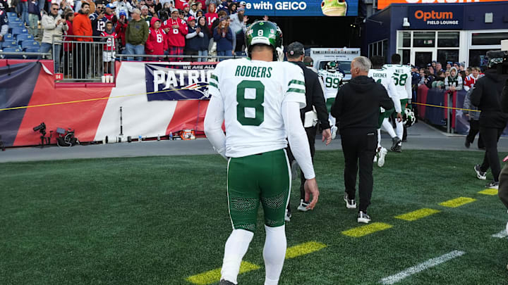 Rodgers leaves the field after the Jets fell to 2-6. 