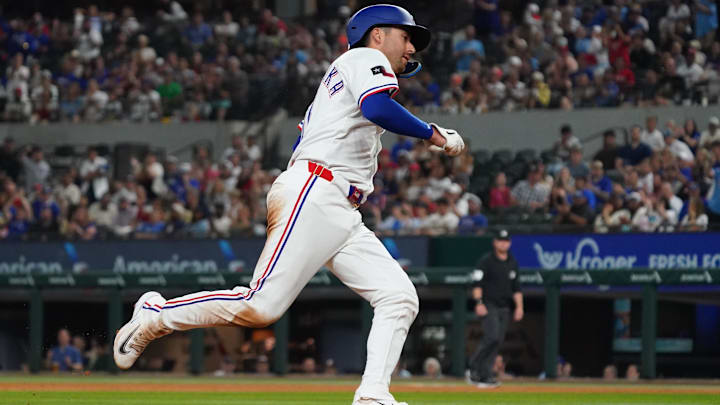 Apr 28, 2025; Arlington, Texas, USA; Texas Rangers catcher Kyle Higashioka (11) runs the bases to score against the Athletics during the sixth inning at Globe Life Field. 
