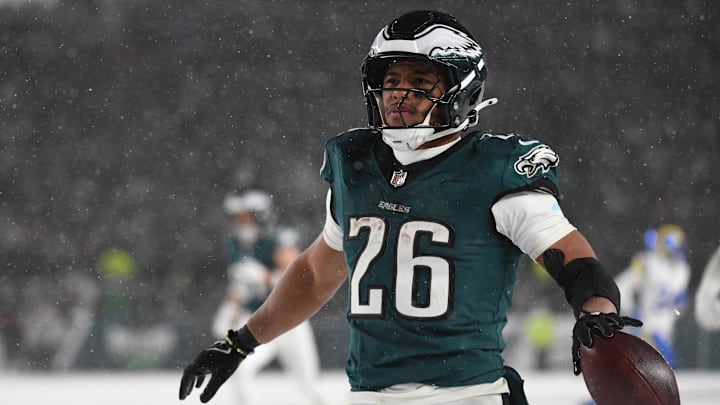 Philadelphia Eagles running back Saquon Barkley (26) celebrates after scoring a touchdown against the Los Angeles Rams in the second half in a 2025 NFC divisional round game at Lincoln Financial Field. 