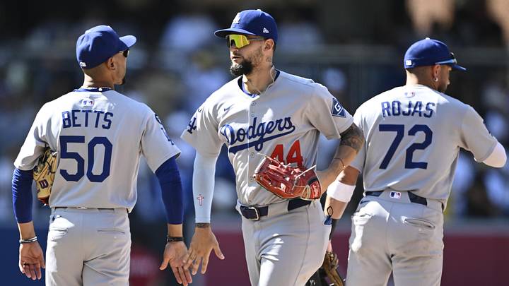 Aug 24, 2025; San Diego, California, USA; Los Angeles Dodgers shortstop Mookie Betts (50), left, Andy Pages (44), center and Miguel Rojas (72) celebrate after the Dodgers beat the San Diego Padres at Petco Park. Mandatory Credit: Denis Poroy-Imagn Images Aug 24, 2025; San Diego, California, USA; Los Angeles Dodgers shortstop Mookie Betts (50), left, Andy Pages (44), center and Miguel Rojas (72) celebrate after the Dodgers beat the San Diego Padres at Petco Park. Mandatory Credit: Denis Poroy-Imagn Images