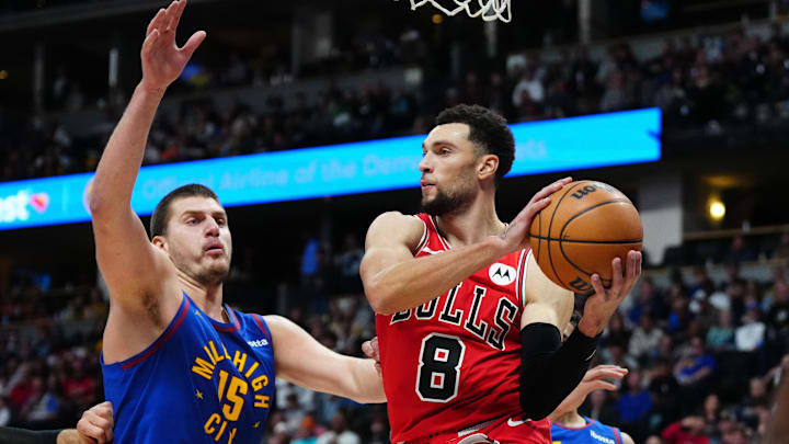  Denver Nuggets center Nikola Jokic (15) defends on Chicago Bulls guard Zach LaVine (8) in the second quarter at Ball Arena. Mandatory Credit: Ron Chenoy-Imagn Images