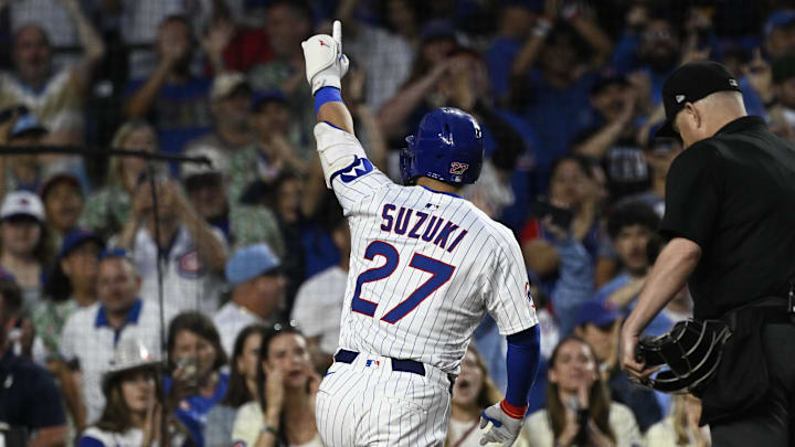 Chicago, Illinois, USA; Chicago Cubs outfielder Seiya Suzuki (27) points after hitting a home run against the St. Louis Cardinals during the fifth inning at Wrigley Field.