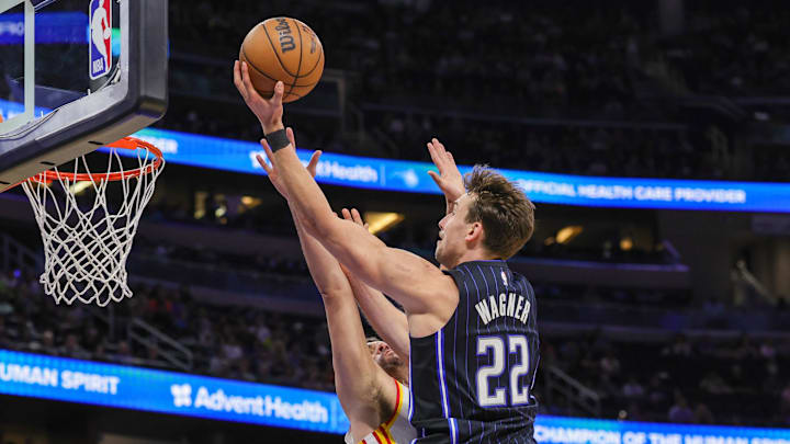 Orlando Magic forward Franz Wagner (22) goes to the basket against Atlanta Hawks forward Georges Niang (20) during the second half at Kia Center.