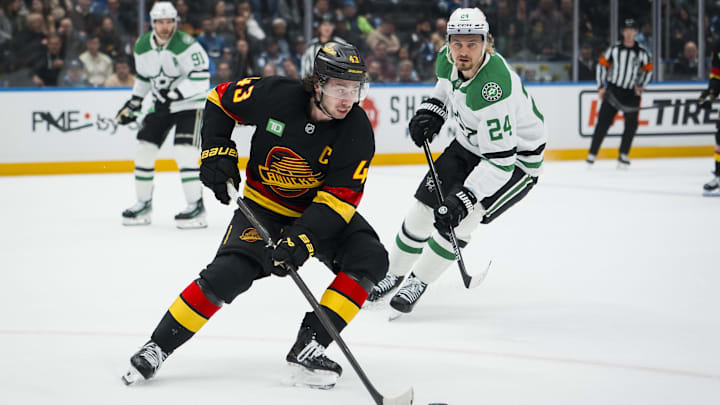 Nov 20, 2025; Vancouver, British Columbia, CAN; Dallas Stars forward Roope Hintz (24) watches Vancouver Canucks defenseman Quinn Hughes (43) handles the puck in the second period at Rogers Arena. Mandatory Credit: Bob Frid-Imagn Images Nov 20, 2025; Vancouver, British Columbia, CAN; Dallas Stars forward Roope Hintz (24) watches Vancouver Canucks defenseman Quinn Hughes (43) handles the puck in the second period at Rogers Arena. Mandatory Credit: Bob Frid-Imagn Images