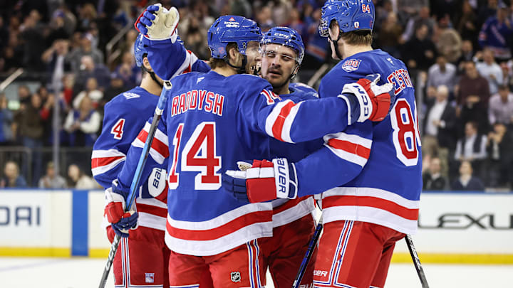 Oct 23, 2025; New York, New York, USA;  New York Rangers right wing Taylor Raddysh (14) celebrates with his teammates after scoring a goal in the first period against the San Jose Sharks at Madison Square Garden. Mandatory Credit: Wendell Cruz-Imagn Images Oct 23, 2025; New York, New York, USA;  New York Rangers right wing Taylor Raddysh (14) celebrates with his teammates after scoring a goal in the first period against the San Jose Sharks at Madison Square Garden. Mandatory Credit: Wendell Cruz-Imagn Images