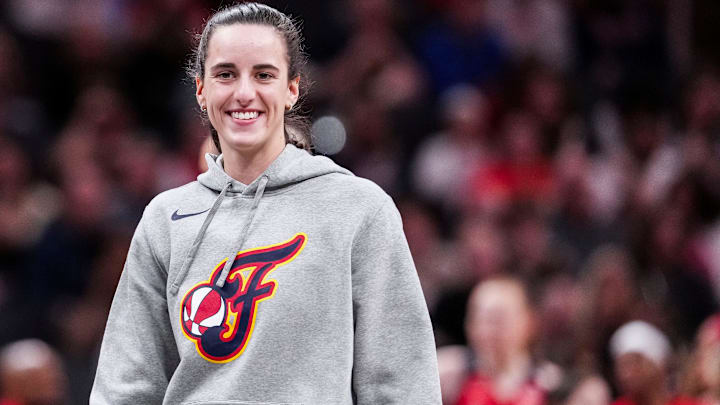 Indiana Fever Caitlin Clark (22) smiles Saturday, May 3, 2025, during a timeout at a preseason game between the Indiana Fever and the Washington Mystics at Gainbridge Fieldhouse in Indianapolis. Indiana Fever Caitlin Clark (22) smiles Saturday, May 3, 2025, during a timeout at a preseason game between the Indiana Fever and the Washington Mystics at Gainbridge Fieldhouse in Indianapolis.