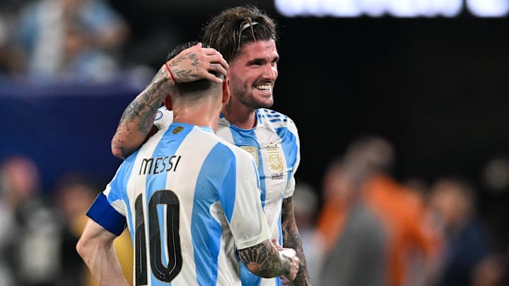 Argentina midfielder Rodrigo de Paul shares a laugh with teammate Lionel Messi during CONMEBOL Copa America USA in 2024.