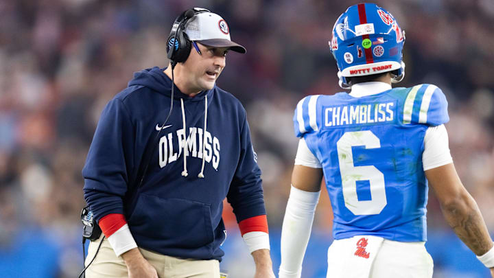 Jan 8, 2026; Glendale, AZ, USA; Mississippi Rebels quarterbacks coach Joe Judge with quarterback Trinidad Chambliss (6) against the Miami Hurricanes during the 2026 Fiesta Bowl and semifinal game of the College Football Playoff at State Farm Stadium. Mandatory Credit: Mark J. Rebilas-Imagn Images