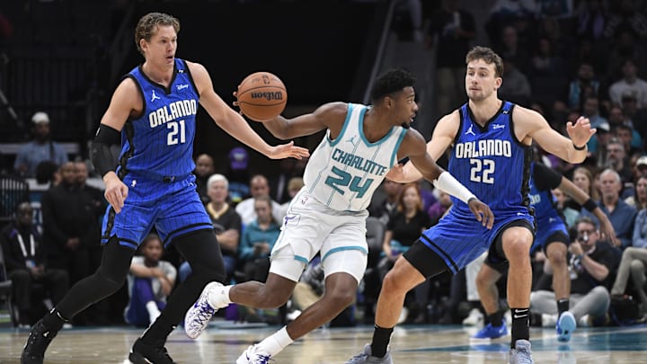 Nov 25, 2024; Charlotte, North Carolina, USA; Charlotte Hornets forward Brandon Miller (24) drives past Orlando Magic center Moritz Wagner (21) and forward Franz Wagner (22) during the first half at the Spectrum Center. Mandatory Credit: Sam Sharpe-Imagn Images Nov 25, 2024; Charlotte, North Carolina, USA; Charlotte Hornets forward Brandon Miller (24) drives past Orlando Magic center Moritz Wagner (21) and forward Franz Wagner (22) during the first half at the Spectrum Center. Mandatory Credit: Sam Sharpe-Imagn Images