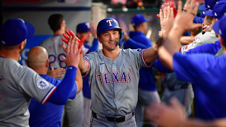 Sep 27, 2024; Anaheim, California, USA; Texas Rangers center fielder Wyatt Langford (36) celebrates after hitting a two run home run against the Los Angeles Angels.