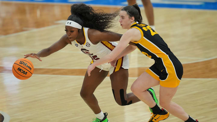 Apr 7, 2024; Cleveland, OH, USA; South Carolina Gamecocks guard Raven Johnson (25) steals the ball from Iowa Hawkeyes guard Caitlin Clark (22) in the finals of the Final Four of the womens 2024 NCAA Tournament at Rocket Mortgage FieldHouse. Mandatory Credit: Aaron Doster-Imagn Images