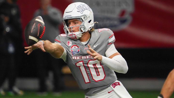 Dec 23, 2025; Frisco, TX, USA;  UNLV Rebels quarterback Anthony Colandrea (10) pitches the ball against the Ohio Bobcats during the second half at the Ford Center at The Star. Mandatory Credit: Raymond Carlin III-Imagn Images