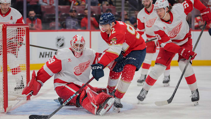 Apr 10, 2025; Sunrise, Florida, USA; Florida Panthers left wing Tomas Nosek (92) attempts to score as Detroit Red Wings goaltender Cam Talbot (39) defends his net during the third period at Amerant Bank Arena. Mandatory Credit: Sam Navarro-Imagn Images