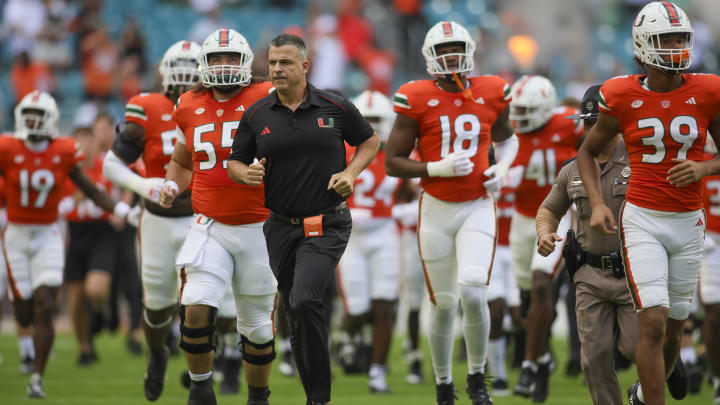 Oct 28, 2023; Miami Gardens, Florida, USA; Miami Hurricanes head coach Mario Cristobal takes on the field prior to the game against the Virginia Cavaliers at Hard Rock Stadium. Mandatory Credit: Sam Navarro-USA TODAY Sports Oct 28, 2023; Miami Gardens, Florida, USA; Miami Hurricanes head coach Mario Cristobal takes on the field prior to the game against the Virginia Cavaliers at Hard Rock Stadium. Mandatory Credit: Sam Navarro-USA TODAY Sports