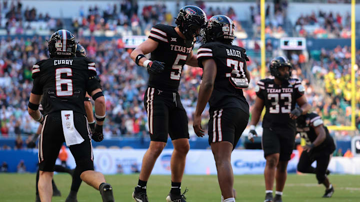 Jan 1, 2026; Miami Gardens, FL, USA; Texas Tech Red Raiders defensive back Cole Wisniewski (5) and linebacker David Bailey (31) react after a defensive play against the Oregon Ducks during the first half of the 2025 Orange Bowl and quarterfinal game of the College Football Playoff at Hard Rock Stadium. Mandatory Credit: Sam Navarro-Imagn Images