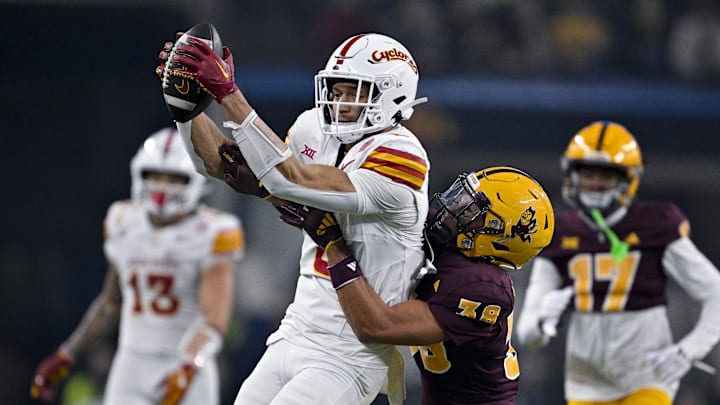 Dec 7, 2024; Arlington, TX, USA; Iowa State Cyclones wide receiver Jayden Higgins (9) catches a pass in front of Arizona State Sun Devils defensive back Kyan McDonald (38) during the second half at AT&T Stadium. Mandatory Credit: Jerome Miron-Imagn Images