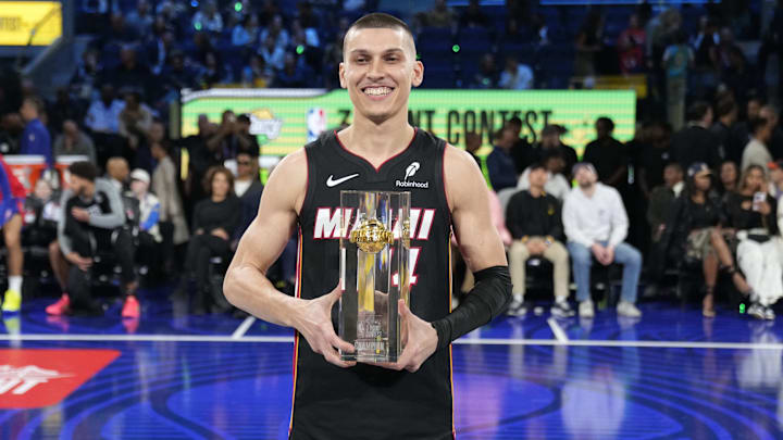 Feb 15, 2025; San Francisco, CA, USA; Miami Heat guard Tyler Herro (14) celebrates with the trophy after winning the three-point contest during All Star Saturday Night ahead of the 2025 NBA All Star Game at Chase Center. Mandatory Credit: Kyle Terada-Imagn Images