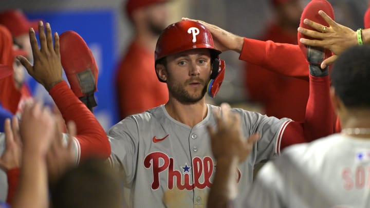 Apr 29, 2024; Anaheim, California, USA; Philadelphia Phillies shortstop Trea Turner (7) is greeted in the dugout after he scored on a sacrifice fly by third baseman Alec Bohm (not pictured) in the ninth inning against the Los Angeles Angels at Angel Stadium Apr 29, 2024; Anaheim, California, USA; Philadelphia Phillies shortstop Trea Turner (7) is greeted in the dugout after he scored on a sacrifice fly by third baseman Alec Bohm (not pictured) in the ninth inning against the Los Angeles Angels at Angel Stadium