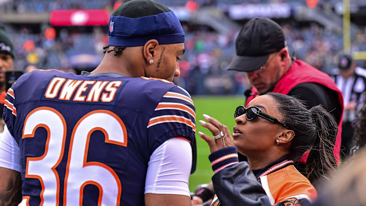 Nov 17, 2024; Chicago, Illinois, USA; Chicago Bears defensive back Jonathan Owens (36) is greeted by wife and United States gymnast Simone Biles before the game against the Green Bay Packers at Soldier Field. 
