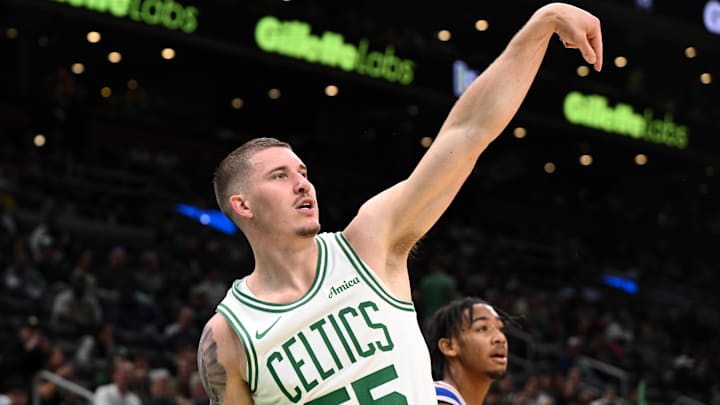 Oct 12, 2024; Boston, Massachusetts, USA; Boston Celtics forward Baylor Scheierman (55) attempts a three-point basket against the Philadelphia 76ers during the second half at the TD Garden. Mandatory Credit: Brian Fluharty-Imagn Images