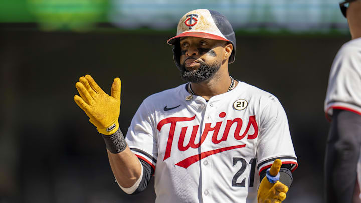 Sep 15, 2024; Minneapolis, Minnesota, USA; Minnesota Twins first baseman Carlos Santana (21) celebrates after hitting a single against the Cincinnati Reds in the fourth inning at Target Field. Mandatory Credit: Jesse Johnson-Imagn Images