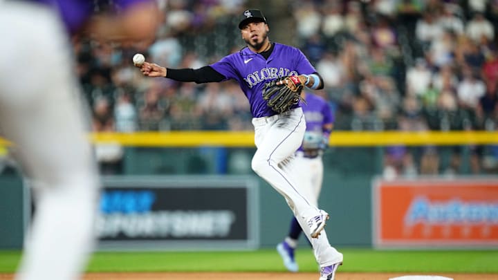 Aug 29, 2023; Denver, Colorado, USA; Colorado Rockies second baseman Harold Castro (30) fields the ball in the seventh inning against the Colorado Rockies at Coors Field.