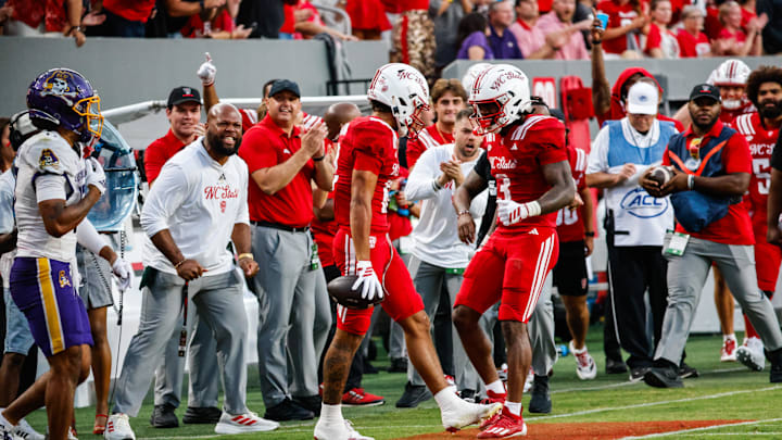 Aug 28, 2025; Raleigh, North Carolina, USA; North Carolina State Wolfpack wide receiver Teddy Hoffmann (12) and running back Hollywood Smothers (3) celebrate a down during the first half of the game against East Carolina Pirates at Carter-Finley Stadium. Mandatory Credit: Jaylynn Nash-Imagn Images Aug 28, 2025; Raleigh, North Carolina, USA; North Carolina State Wolfpack wide receiver Teddy Hoffmann (12) and running back Hollywood Smothers (3) celebrate a down during the first half of the game against East Carolina Pirates at Carter-Finley Stadium. Mandatory Credit: Jaylynn Nash-Imagn Images