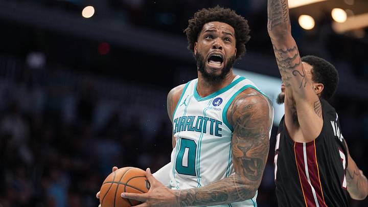 Apr 14, 2026; Charlotte, North Carolina, USA; Charlotte Hornets forward Miles Bridges (0) goes to the basket against Miami Heat center Kel'el Ware (7) during the second half during the play-in rounds between the Charlotte Hornets and the Miami Heat of the 2026 NBA Playoffs at Spectrum Center. Mandatory Credit: Jim Dedmon-Imagn Images Apr 14, 2026; Charlotte, North Carolina, USA; Charlotte Hornets forward Miles Bridges (0) goes to the basket against Miami Heat center Kel'el Ware (7) during the second half during the play-in rounds between the Charlotte Hornets and the Miami Heat of the 2026 NBA Playoffs at Spectrum Center. Mandatory Credit: Jim Dedmon-Imagn Images