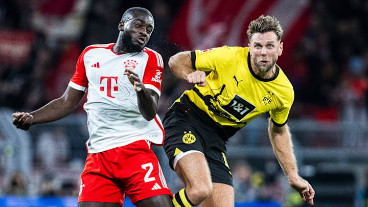 Dayot Upamecano mit Niclas Füllkrug im Luft-Duell