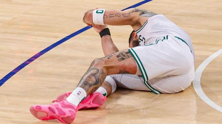 May 12, 2025; New York, New York, USA; Boston Celtics forward Jayson Tatum (0) reacts on the court after an injury in the second half during game four of the second round for the 2025 NBA Playoffs against the New York Knicks at Madison Square Garden. Tatum would leave the game with an injury after this play. Mandatory Credit: Vincent Carchietta-Imagn Images