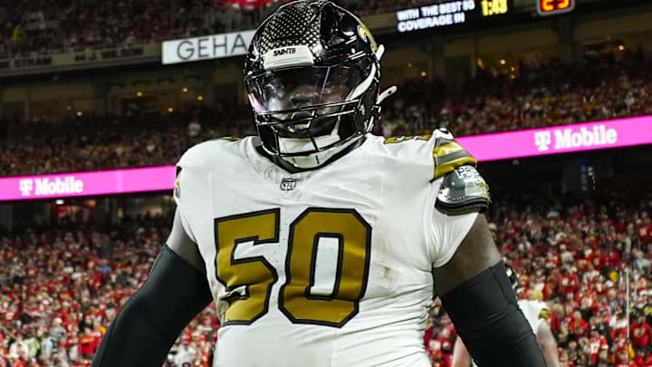 Oct 7, 2024; Kansas City, Missouri, USA; New Orleans Saints defensive tackle Khalen Saunders (50) reacts after an interception during the second half against the Kansas City Chiefs at GEHA Field at Arrowhead Stadium. Mandatory Credit: Jay Biggerstaff-Imagn Images