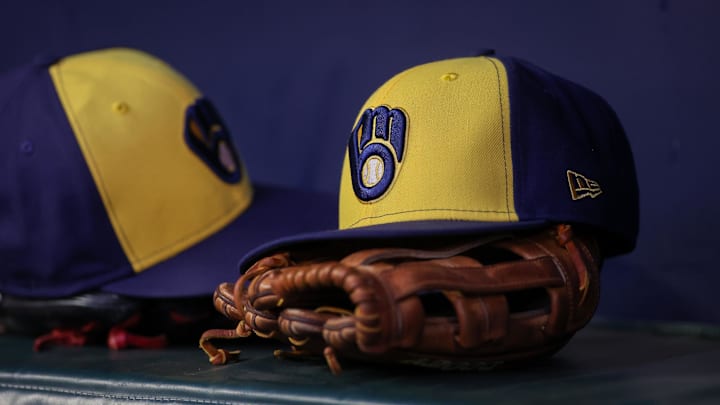 Jul 28, 2023; Atlanta, Georgia, USA; A detailed view of a Milwaukee Brewers hat and glove on the bench against the Atlanta Braves in the second inning at Truist Park. Mandatory Credit: Brett Davis-Imagn Images Jul 28, 2023; Atlanta, Georgia, USA; A detailed view of a Milwaukee Brewers hat and glove on the bench against the Atlanta Braves in the second inning at Truist Park. Mandatory Credit: Brett Davis-Imagn Images