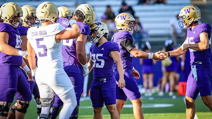 The Huskies, encouraging each other at the fall mock game, are prepared to have a big season. The Huskies, encouraging each other at the fall mock game, are prepared to have a big season.