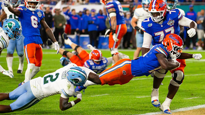 Florida Gators running back Jadan Baugh (13) dives across the goal line for touchdown but it was called back during the second half at Raymond James Stadium in Tampa, FL on Friday, December 20, 2024 in the 2024 Union Home Mortgage Gasparilla Bowl. The Gators defeated Tulane 33-8. [Doug Engle/Gainesville Sun]