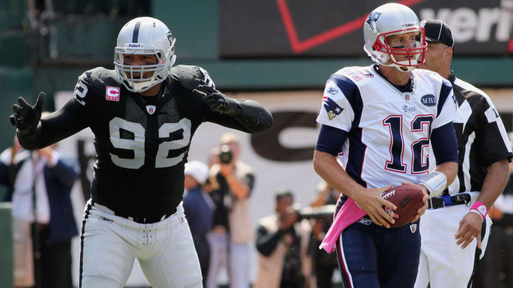 Oct 2, 2011; Oakland, CA, USA; Oakland Raiders defensive end Richard Seymour (92) reacts after being called for a personal foul against New England Patriots quarterback Tom Brady (12) in the first quarter at O.co Coliseum. Mandatory Credit: Cary Edmondson-USA TODAY Sports