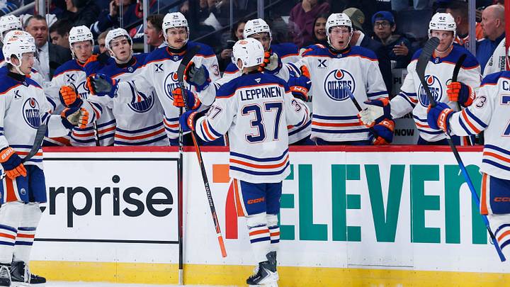 Sep 22, 2026; Winnipeg, Manitoba, CAN;  Edmonton Oilers defenseman Arto Leppanen (37) is congratulated by his team mates for scoring a goal against the Winnipeg Jets during the first period at Canada Life Centre.  Mandatory Credit: Terrence Lee-Imagn Images