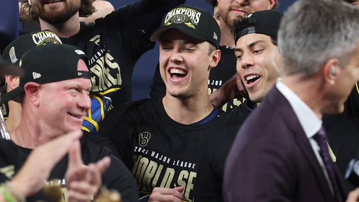 Oct 28, 2026; St. Petersburg, Florida, USA;  Milwaukee Brewers pitcher Jacob Misiorowski (32) and designated hitter Christian Yelich (22) celebrate with teammates on the podium after defeating the Tampa Bay Rays in game five of the 2026 World Series at Tropicana Field.  Mandatory Credit: Nathan Ray Seebeck-Imagn Images