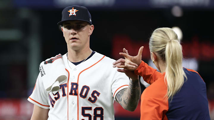 Mar 31, 2026; Houston, Texas, USA;  Houston Astros starting pitcher Hunter Brown (58) high fives trainer Stephanie Grubbs as 